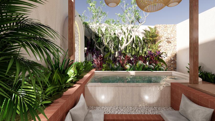Plunge pool framed by tropical planting and a stone wall
