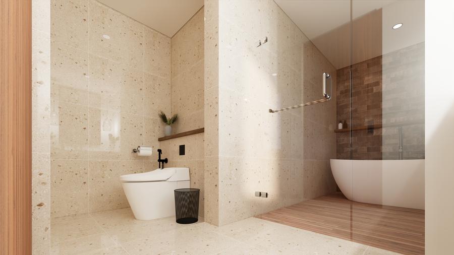 Stone bathroom with a freestanding bath and walk-in shower